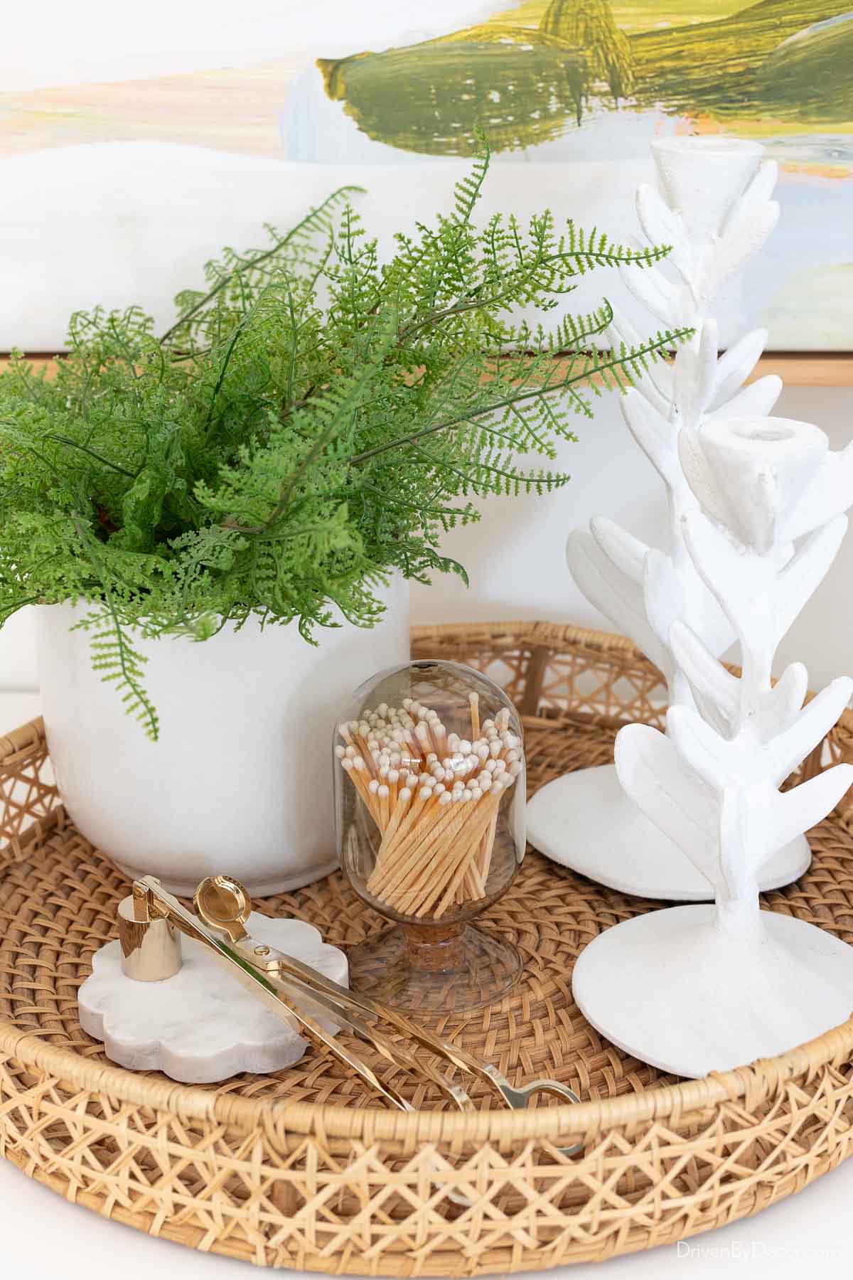 Round woven tray with accessories in dining room