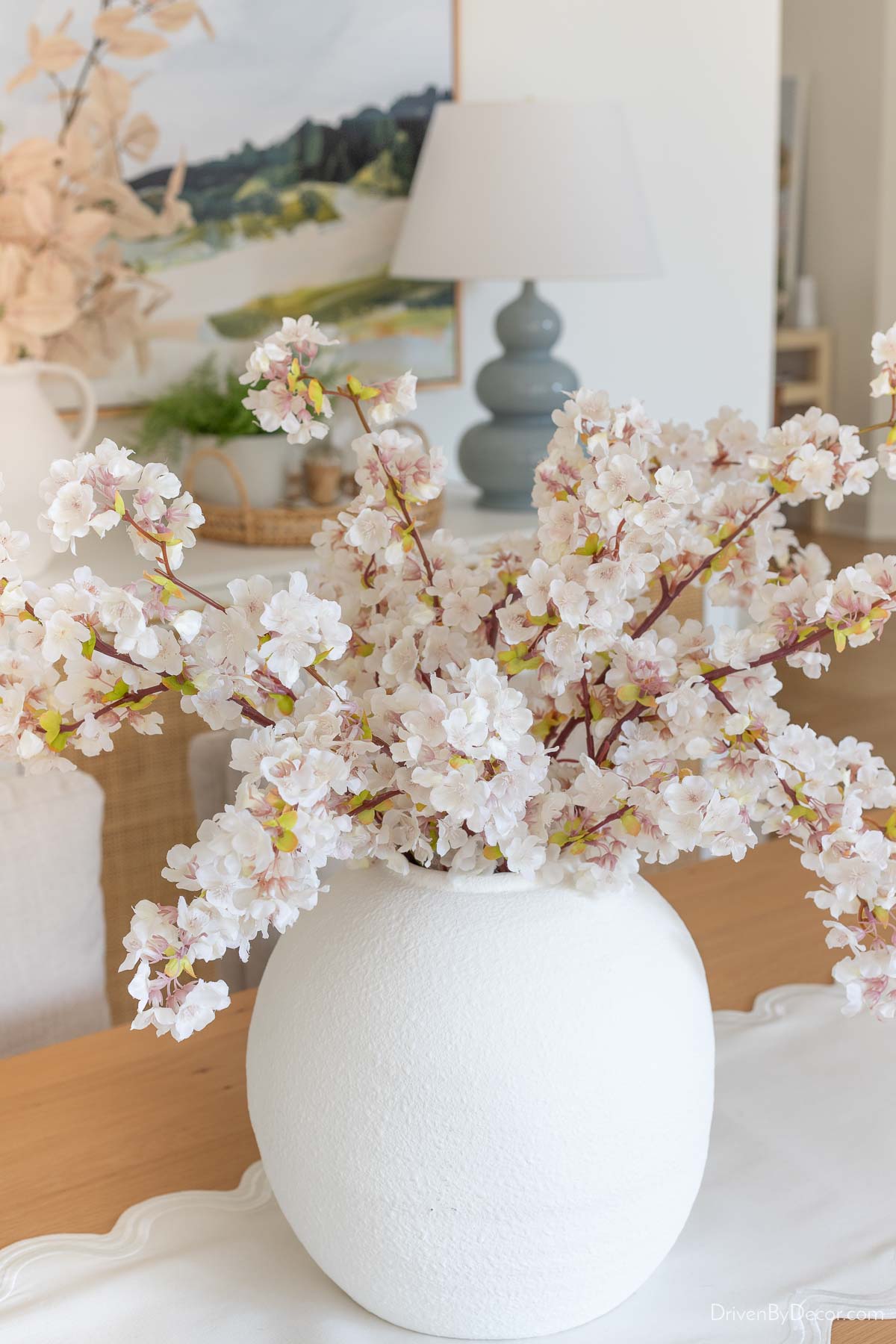 Faux cherry blossoms as dining room centerpiece