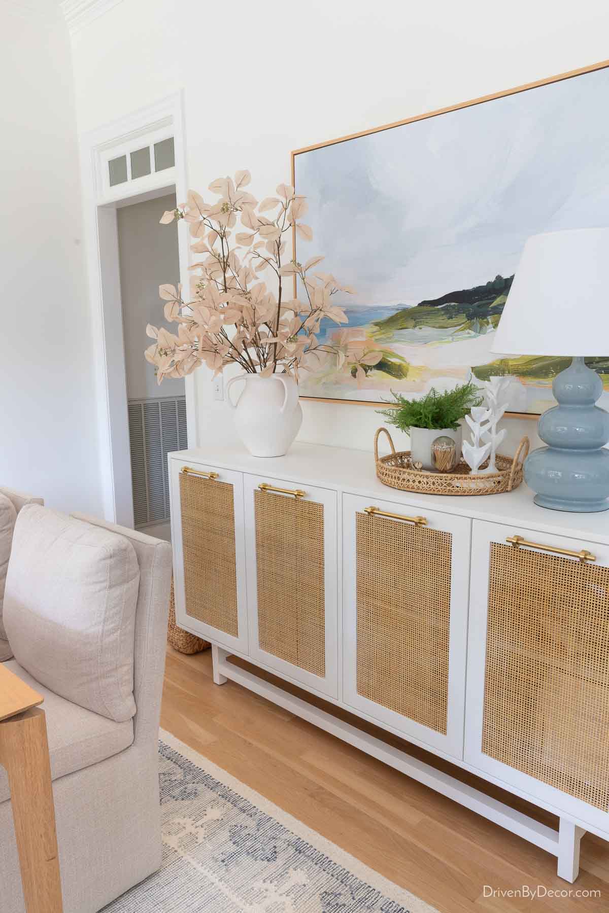 Dining room console with woven rattan doors